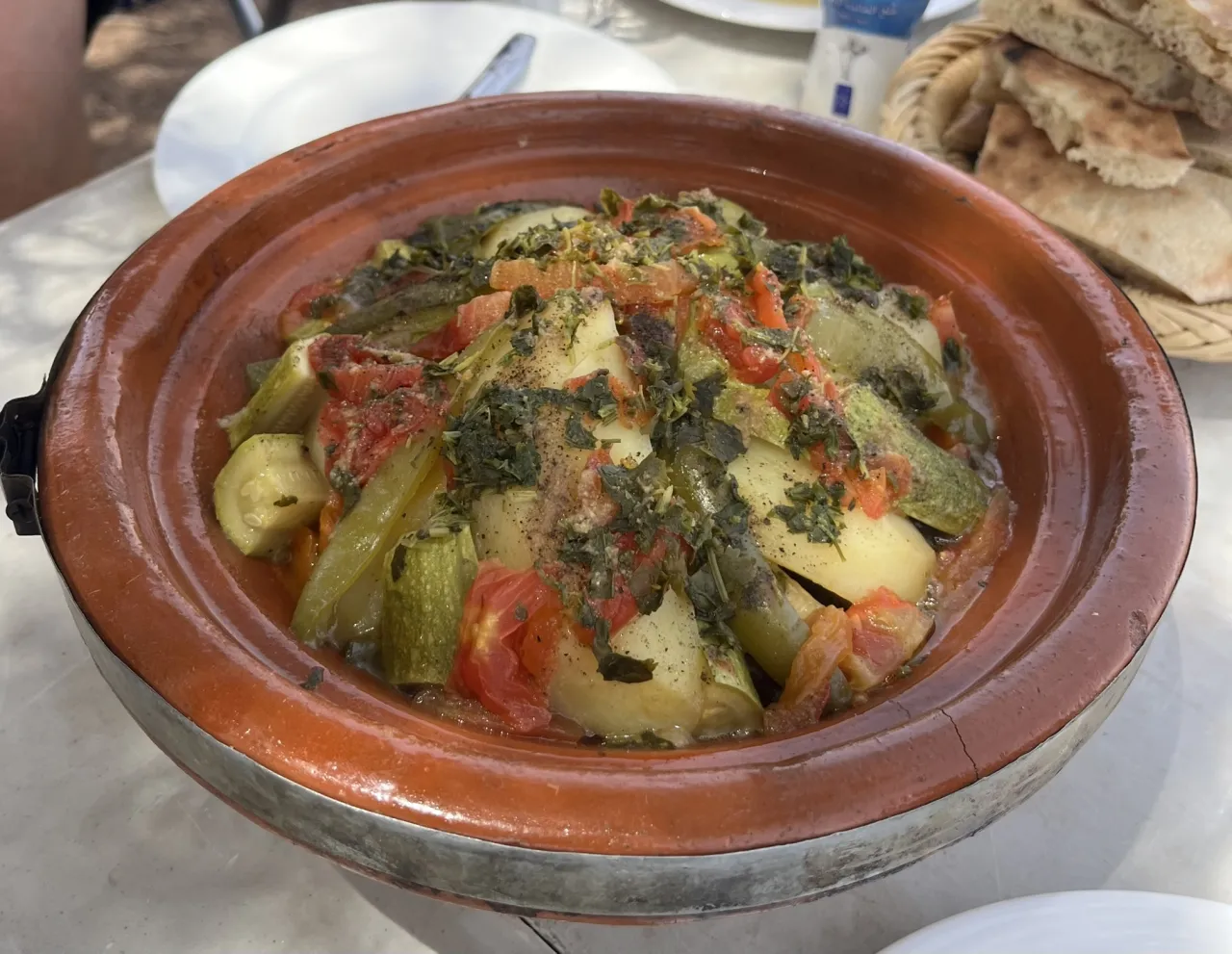 Chicken tagine, bread and mint tea served to cyclists in a mountain guesthouse